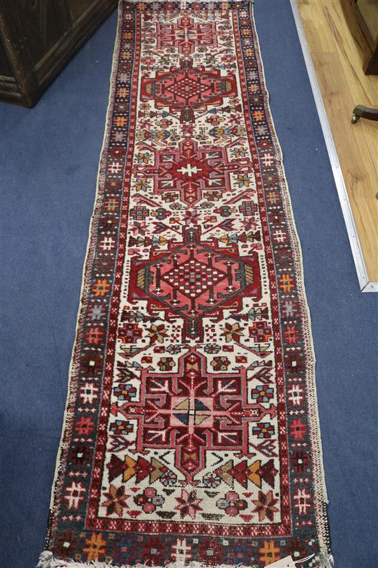 A cream ground runner, 260 x 70cm